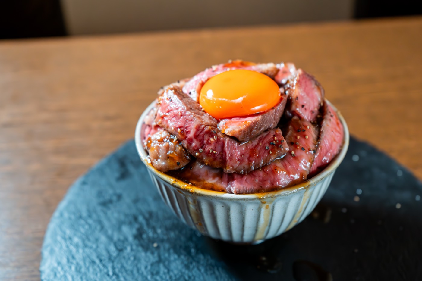 Wagyu steak rice bowl topped with egg yolk at Godaime Wagyu Tokyo in Ginza